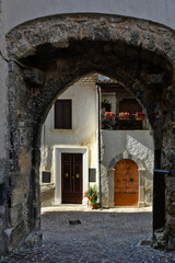 Fototapeta na wymiar A narrow street among the old houses of Castrovalva, a medieval village in the Abruzzo region.
