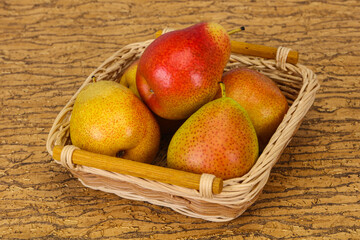 Pear heap in the wooden basket