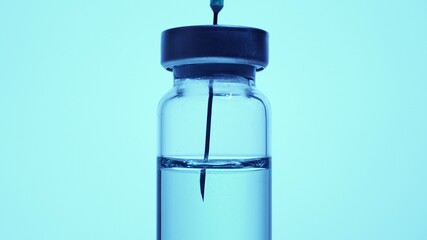 Vaccine taken with medical syringe needle. Vaccination treatment from Covid-19 coronavirus flu strain virus. Virologist researcher scientist development and test. Vaccination of patient.