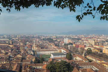 Fototapeta premium view point from the castle on the city of Brescia on a sunny clear day against a bright blue sky. Brescia castle. Brescia, Lombardy, Italy.