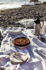 Beach picnic with cake and tea