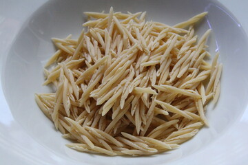 durum pasta on a white plate, pasta trofie