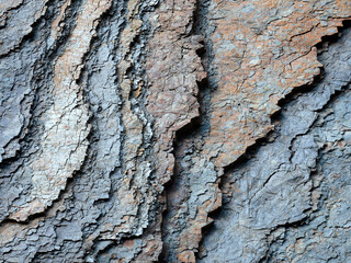 Crumbling layered sedimentary rock slab with textured effect