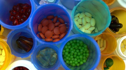 Concept of world pharmaceutical medical research, trials and developing coronavirus drugs or vaccines. Hydroxychloroquine or chloroquine covid-19 bottles pills in medical lab macro view.