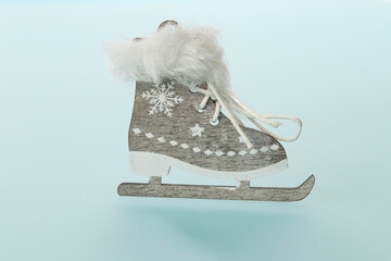 Little wooden skate  ornament on bluish backround
