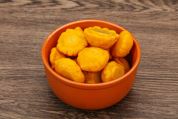Marinated yellow patisson in the bowl