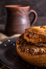 Autumn still life, fresh baked bun on wooden background