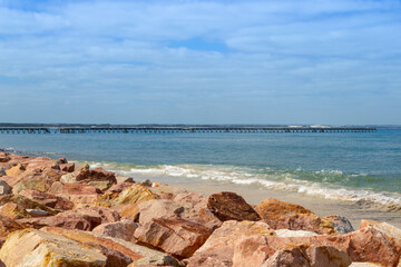 View to an old broken wooden bridge from the Esplanade in the town of Esperance, Western Australia
