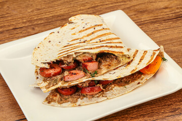 Quesadilla with sausages and beans