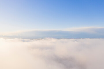 Obraz premium Aerial view white clouds in blue sky. Aerial top view cloudscape. Texture of clouds. View from above. Clouds texture background. Panorama clouds texture