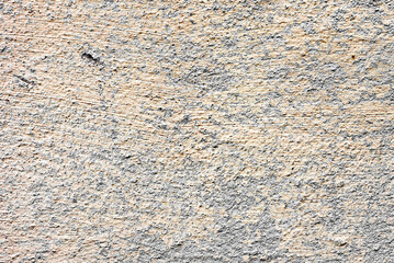 Texture of a concrete wall with cracks and scratches which can be used as a background