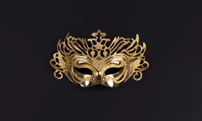Fotobehang golden masquerade mask isolated on black background © serikbaib