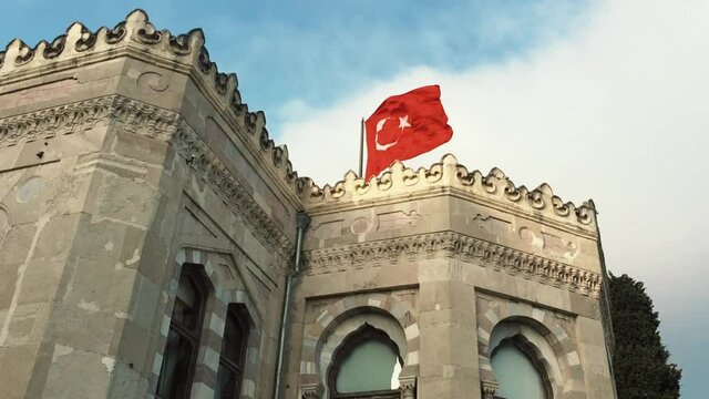 National flag of Turkey on roof of University of Istanbul filmed in spring season