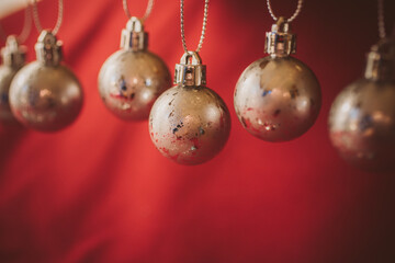 Golden christmas balls on red background. Christmas background.  