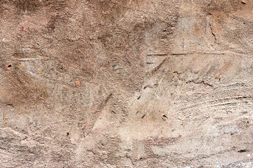 Texture of a concrete wall with cracks and scratches which can be used as a background