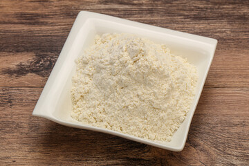 Wheat flour heap in the bowl