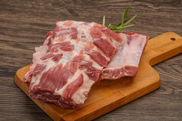 Raw pork ribs served rosemary