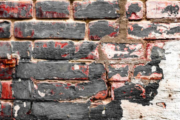 Texture of a brick wall with cracks and scratches which can be used as a background