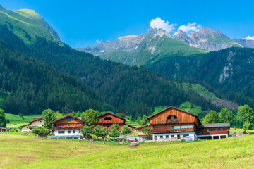 Obraz premium Mountain valley village landscape in Venediger alps . Mountain green valley village view austria near matrei in osttirol
