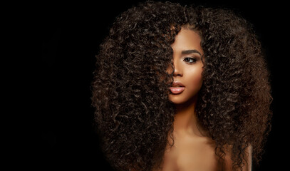 Beauty Fashion model. Black woman face & beautiful voluminous hair. Afro american girl. Beauty skin...