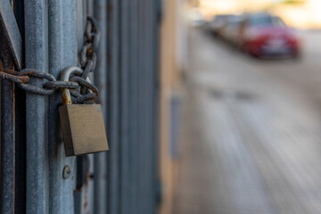 Fence of a closed business with a chain and a lock