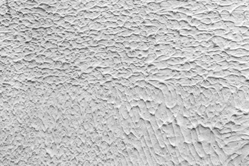 Texture of white plaster. Interior of a modern loft. Abstract rough background. The facade of an old house.