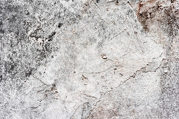Texture of a concrete wall with cracks and scratches which can be used as a background