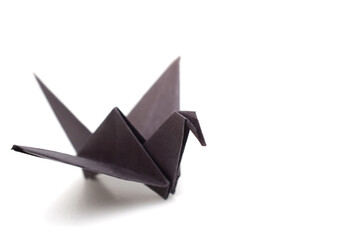 A black paper origami bird