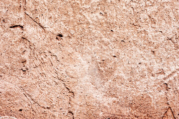 Texture of a concrete wall with cracks and scratches which can be used as a background
