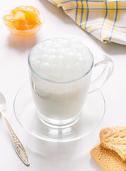 Milk in a mug with bubbles. Breakfast.