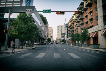 Active people on the streets, with classic stores and signage in Austin, Texas. Austin is the state capital of Texas. © otmman