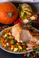 Fototapeta na wymiar Roasted sliced turkey breast. Thanksgiving dinner table