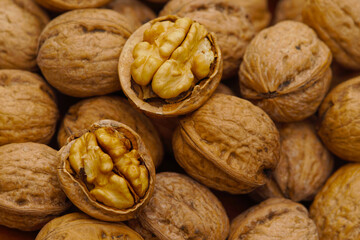 Some walnuts on dark table