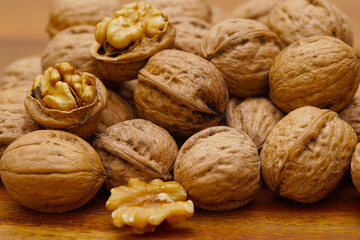 Some walnuts on dark table