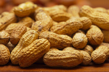 A lot of peanuts on dark table