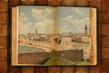 Old open book. Ancient arab city of Acre, Akko. View on  historical fortification. Mediterranean, Israel. Image designed on old paper textured pages in aged style. Vintage book spines as a background