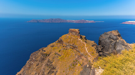 A view from the village of Imerovigli, Santorini towards Skaros Rock and the caldera in summertime