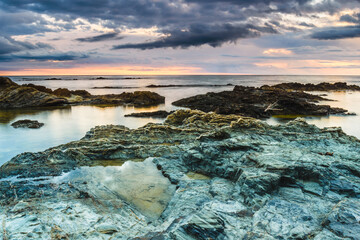 Sunrise at the rocky coastline of the Mediterranean Sea. (Emporda, Costa Brava, Catalonia, Spain)