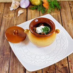 Meat in a pot on the table