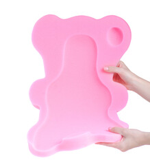 Foam mattress pillow for bath baby in hand on white background isolation