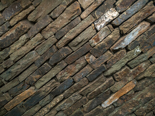 Stone texture background, copy space. Detail of stone abstract background, free space. Decorative uneven cracked stone wall surface