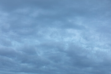 Fototapeta premium Background of gray clouds at sky at dawn