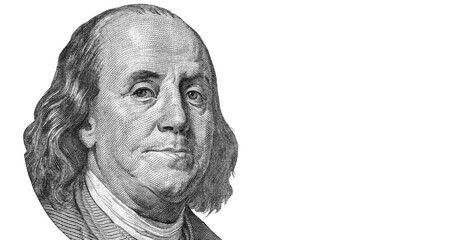 Close up Benjamin Franklin (one hundred US Dollar). Money, business and finance concept. Isolated on white background.