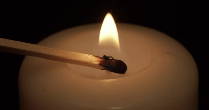 Lighting up a candle and blowing it out