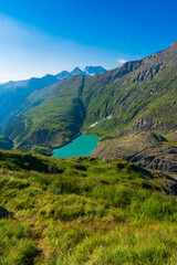 Naklejka premium The beautiful view of mountain nature with lake in Glockner alps europe- taken from The Grossglockner High Alpine Road - Grossglockner Hochalpenstrasse