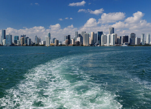 Panoramic View To The Skyline Of Miami From A Vessel On A Sunny Autumn Day With A Clear Blue Sky And A Few Clouds