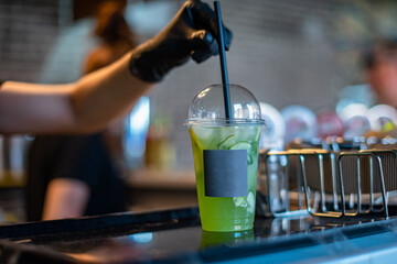 Fototapeta na wymiar bartender pouring cocktail in bar