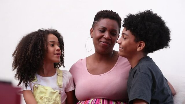 Mother and children love and care. Mix race parent with kids showing affection