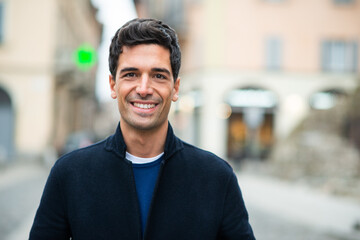 Young man walking in a city