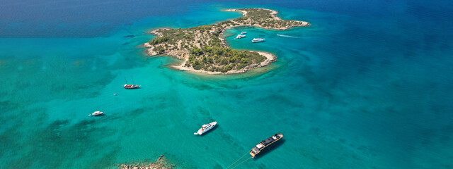Aerial drone ultra wide panoramic photo of tropical exotic mediterranean bay with luxurious yachts and turquoise sea